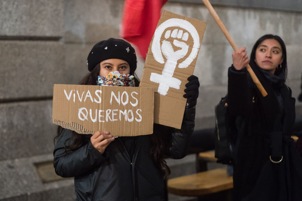 LONDON, UNITED KINGDOM - MARCH 08: A women holds a placard in Trafalgar Square during an international protest against violence towards women, institutional misogyny in the police, gender pay gap and the anti-refugee rhetoric on International Women's Day in London, United Kingdom on March 08, 2023. (Photo by Wiktor Szymanowicz/Anadolu Agency via Getty Images)